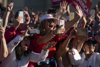 Supporters of President Donald Trump cheer as he walks off stage after speaking during a campaign rally at Phoenix Goodyear Airport, Wednesday, Oct. 28, 2020, in Goodyear, Ariz. (AP Photo/Evan Vucci)