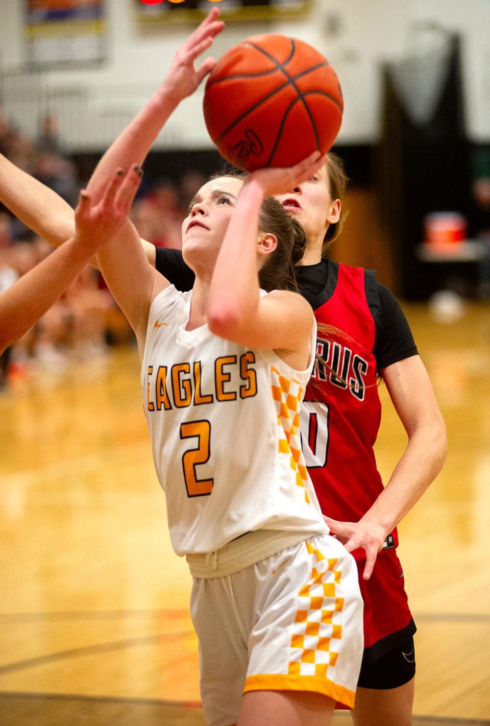 Colonel Crawford's Gabby Roston finishes at the basket.