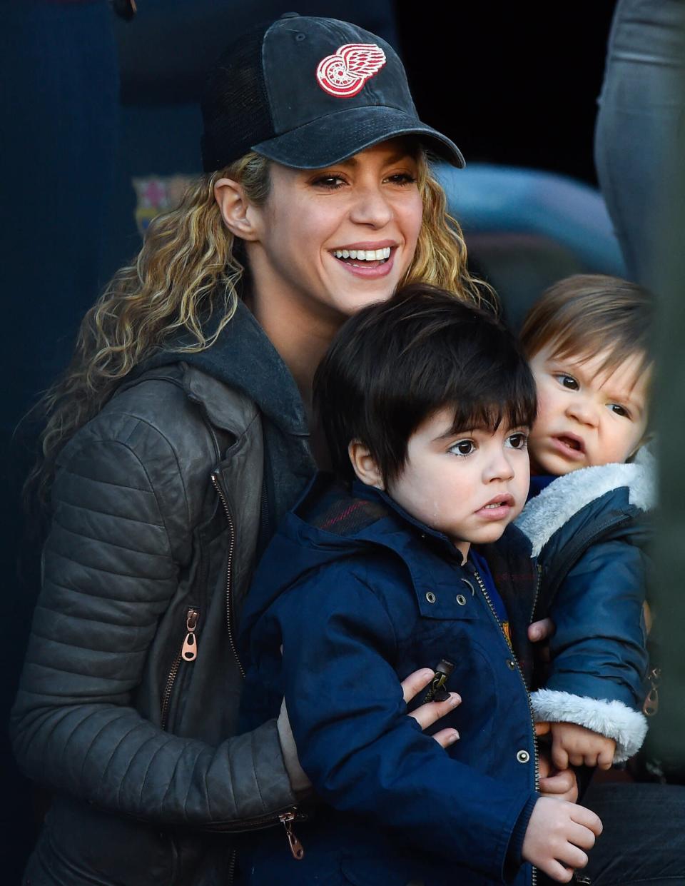 Shakira carries her children Milan and Sasha ahead of the La Liga match between FC Barcelona and Real Sociedad de Futbol at Camp Nou on November 28, 2015 in Barcelona, Spain