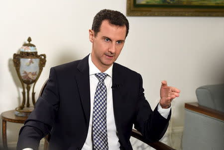 Syria's President Bashar al-Assad speaks during an interview with Spanish newspaper El Pais in Damascus, in this handout picture provided by SANA on February 20, 2016. Picture taken February 20, 2016. REUTERS/SANA/Handout via Reuters