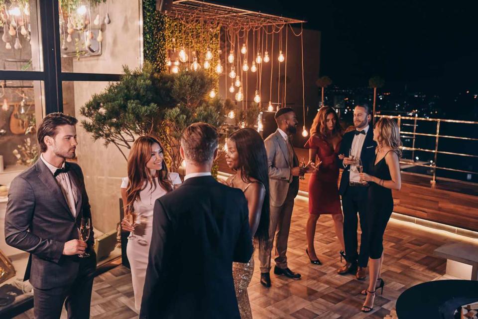 <p>Getty</p> Stock photo of people in formalwear at a celebration