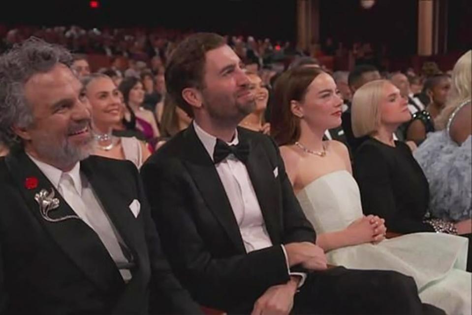 Emma Stone and her husband, Dave McCary, in the audience for the 2024 Oscars. NBC