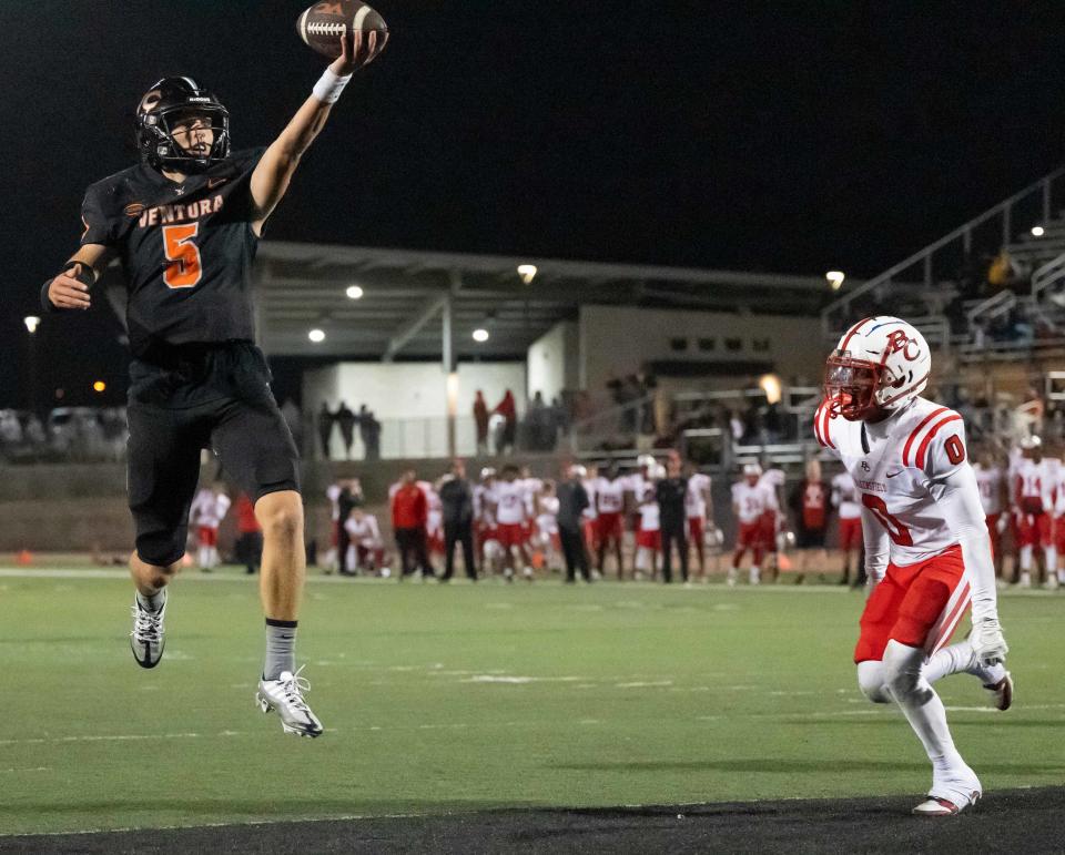 Ventura College quarterback Chris Irvin scores a touchdown against visiting Bakersfield College during the third quarter of the Pirates' win Saturday night at the VC Sportsplex.