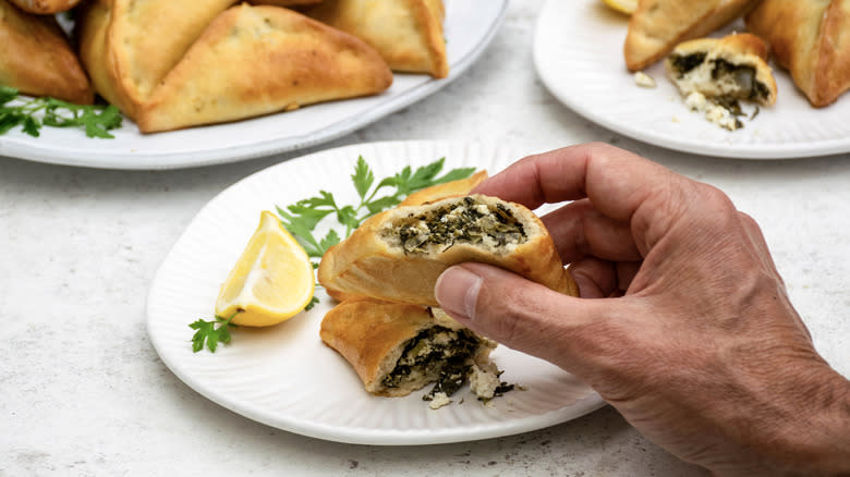 spinach fatayer with hand