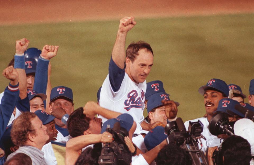 FILE - Texas Rangers pitcher Nolan Ryan is carried off the field by his teammates after throwing his seventh no-hitter against the the Toronto Blue Jays in Arlington, Texas, May 1, 1991. Hall of Fame pitcher Nolan Ryan is the subject of a new documentary. (AP Photo/Bill Janscha, File)