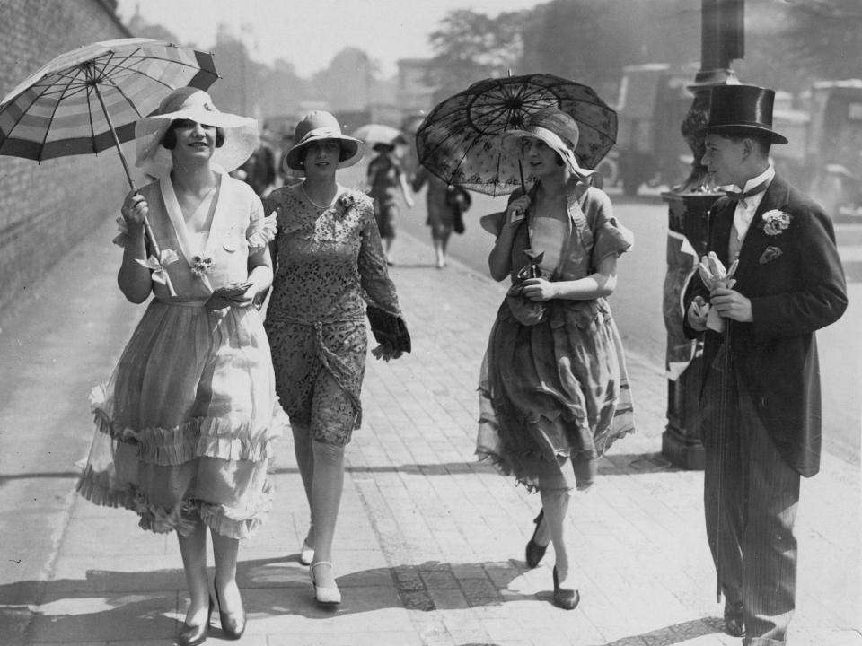 Fashionable women arrive at Lord's cricket ground for the Eton vs. Harrow match in 1928.