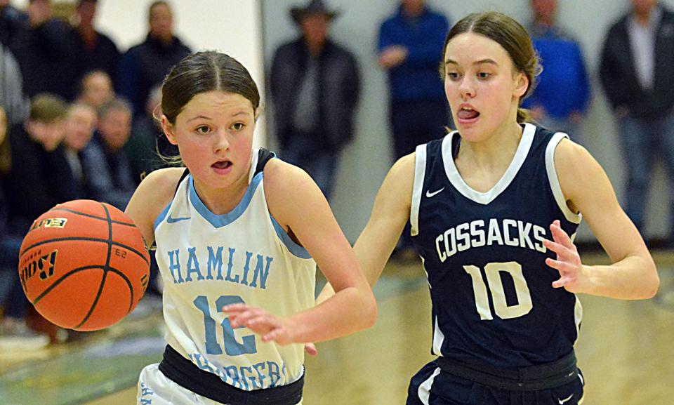 Hamlin's Paxton Neuendorf dribbles down the court against Sioux Valley's Talya Vincent during their high school girls basketball game on Monday, Feb. 5, 2024 at the Hamlin Education Center. Sioux Valley won 42-37.