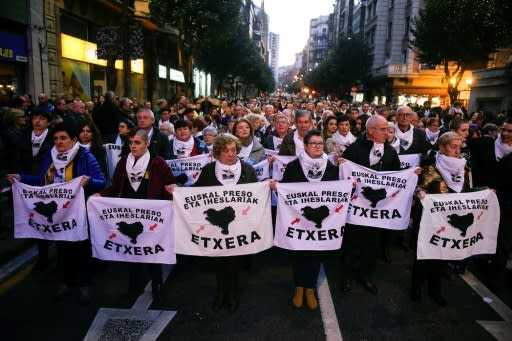 Relatives of Basque prisoners hold banners reading "Basques prisoners and fugitives back home" during a protest in the northern Spanish city of Bilbao to demand the transfer of ETA prisoners to jails near their homes