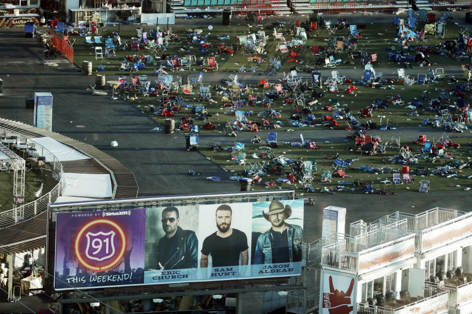 FILE - Personal belongings and debris litters the Route 91 Harvest festival grounds across the street from the Mandalay Bay resort and casino in Las Vegas, on Oct. 3, 2017. The Supreme Court has struck down a Trump-era ban on bump stocks, a gun accessory that allows semiautomatic weapons to fire rapidly like machine guns. They were used in the deadliest mass shooting in modern U.S. history. The high court Friday found the Trump administration did not follow federal law when it reversed course and banned bump stocks after a gunman in Las Vegas attacked a country music festival with assault rifles in 2017. (AP Photo/Marcio Jose Sanchez, File)