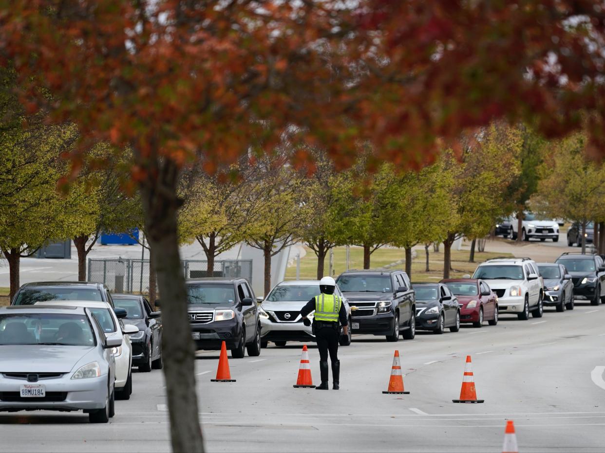 <p>In Texas, hundreds of vehicles lined up to pick up food ahead of Thanksgiving </p> (AP)