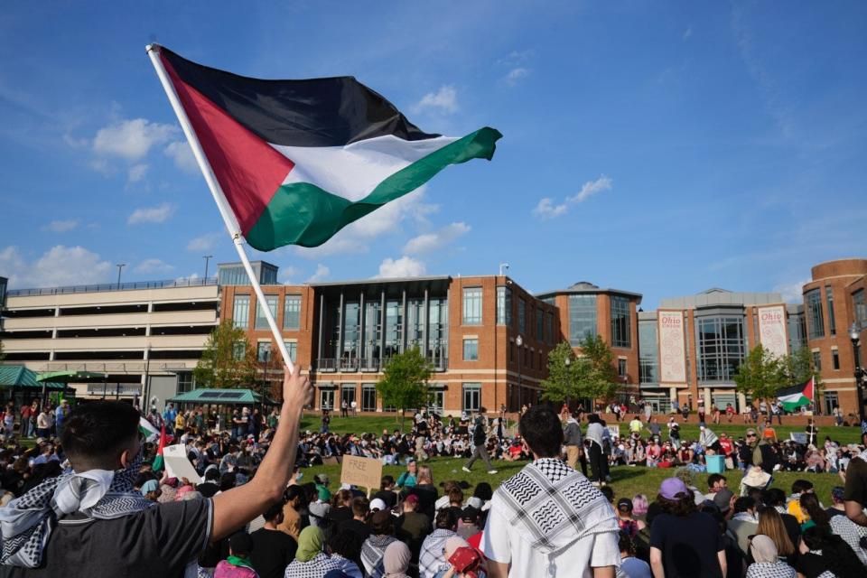 Several hundred protesters gathered May 1 at Ohio State University's South Oval for a demonstration in support of Palestine and calling for OSU to divest from businesses with links to Israel