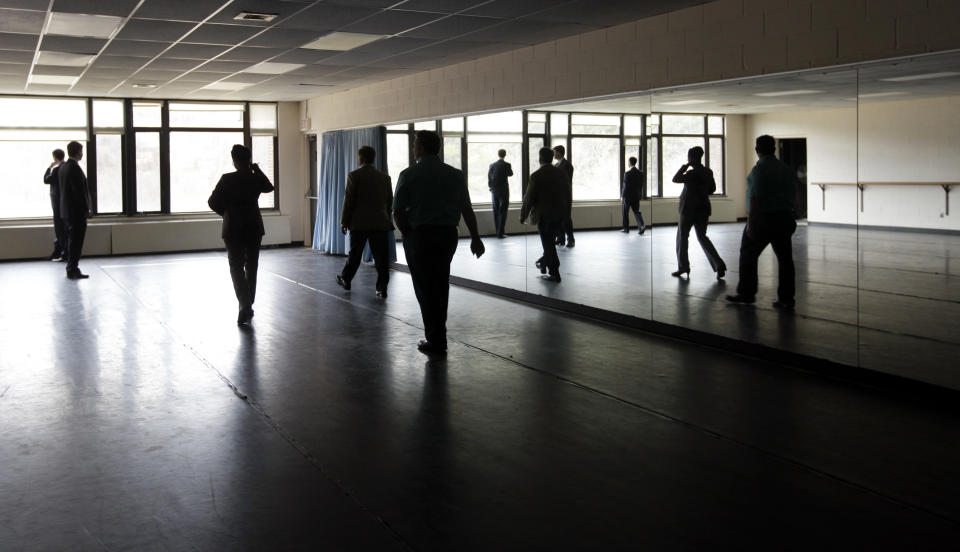 Interested people from Olivet University and the World Evangelical Alliance walk through a dance studio in the gymnasium on an historic 217-acre campus in Northfield, Mass., in this photo taken Thursday, March 8, 2012. The campus, along with its 43 buildings, is being offered for free to an orthodox Christian group who can come up a solid plan to use it. (AP Photo/Elise Amendola)