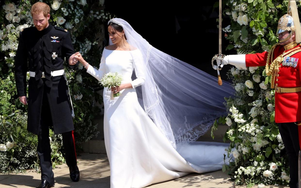 Prince Harry and Meghan Markle exit St. George's Chapel on May 19. 