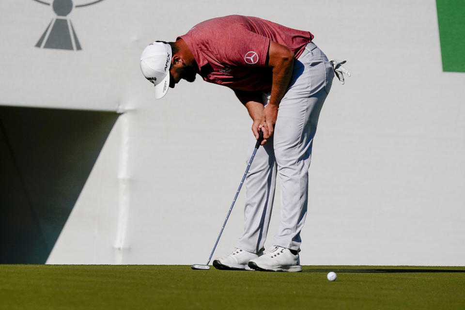 Jon Rahm reacts to a missed putt on the 16th hole during the final round of the Phoenix Open golf tournament, Sunday, Feb. 12, 2023, in Scottsdale, Ariz. (AP Photo/Darryl Webb)