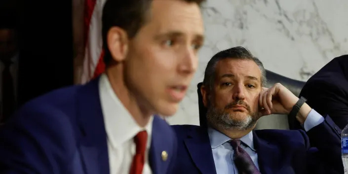 Sen. Ted Cruz of Texas looks on as Sen. Josh Hawley of Missouri speaks at a hearing on Capitol Hill on March 22, 2022.