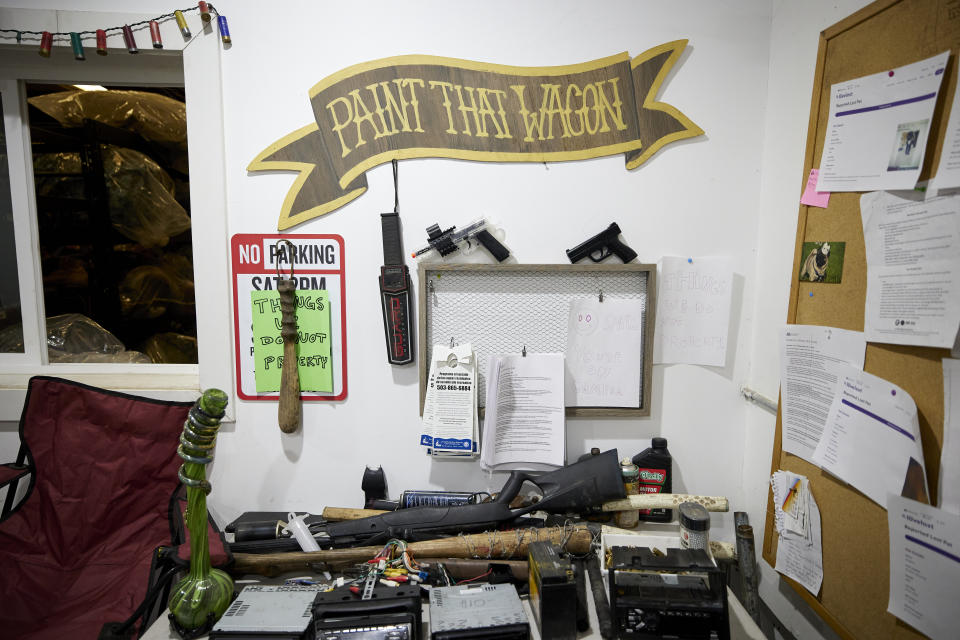 THIS CORRECTS THE NAME OF THE CONTRACTOR TO RAPID RESPONSE BIO CLEAN, NOT RAPID RESPONSE BIO CLEANUP AS ORIGINALLY SENT - Prohibited items that have been collected by Rapid Response Bio Clean while cleaning homeless camps sit on a table in the company warehouse in Portland, Ore., Thursday, July 27, 2023. Weapons, car parts and drug paraphernalia are not allowed to be returned to people whose items have been confiscated during a sweep. Cities across the U.S. are struggling with and cracking down on tent encampments as the number of homeless people grows, largely due to a lack of affordable housing. Homeless people and their advocates say sweeps are cruel and costly, and there aren't enough homes or beds for everyone. (AP Photo/Craig Mitchelldyer)