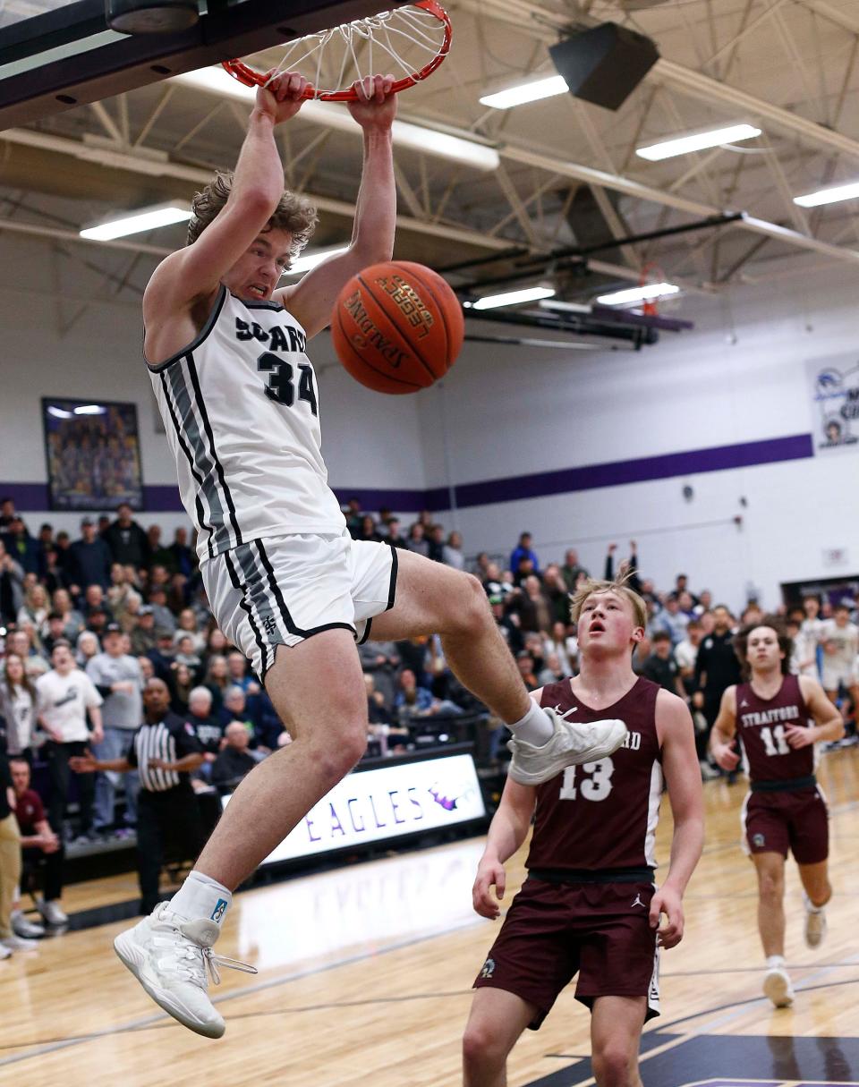  Sparta's Jacob Lafferty completes the fast break with a dunk against Strafford in district basketball action at Fair Grove High School on Feb 24, 2023.