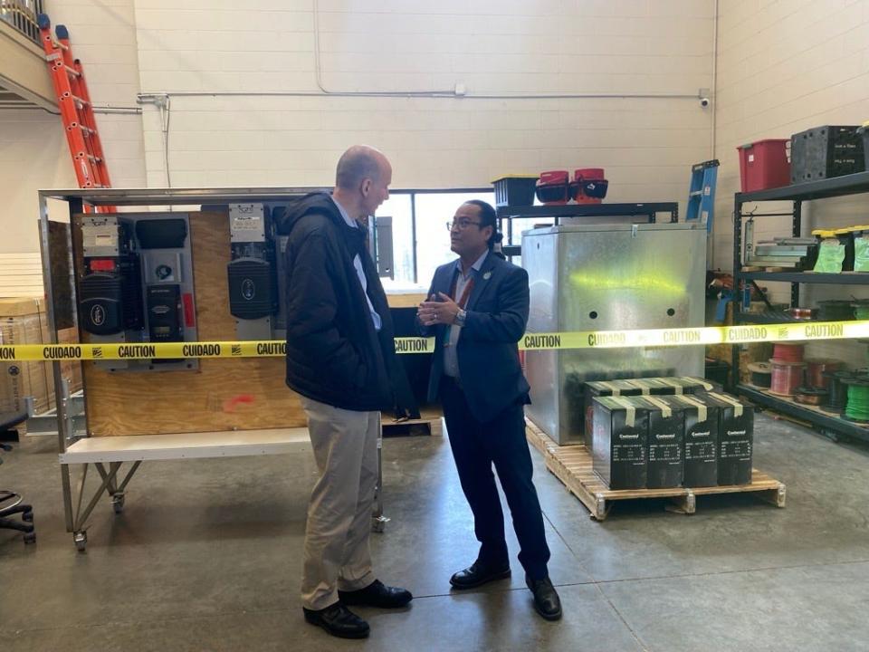 U.S. Deputy Energy Secretary David M. Turk (left) and Navajo Nation President Dr. Buu Nygren speak after a tour of Native Renewables Inc. in Flagstaff on Feb. 28, 2024.