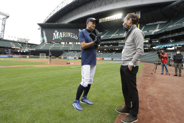 Seattle Mariners' Ichiro Suzuki adjusts his helmet after hitting a