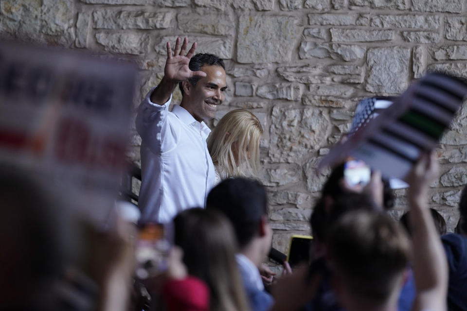 Texas Land Commissioner George P. Bush arrives for a kick-off rally with his wife Amanda to announced he will run for Texas Attorney General, Wednesday, June 2, 2021, in Austin, Texas. (AP Photo/Eric Gay)