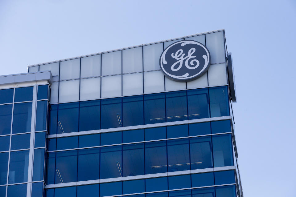 FILE - In this Jan. 16, 2018 file photo, the General Electric logo is displayed at the top of their Global Operations Center in the Banks development of downtown Cincinnati. General Electric says it will sell its biopharma business to Danaher Corp. for $21.4 billion as the former industrial giant continues to shrink itself. The biopharma unit was part of GE Life Sciences and had revenues of about $3 billion last year. The mostly-cash transaction is expected to close in the fourth quarter of this year. (AP Photo/John Minchillo, File)