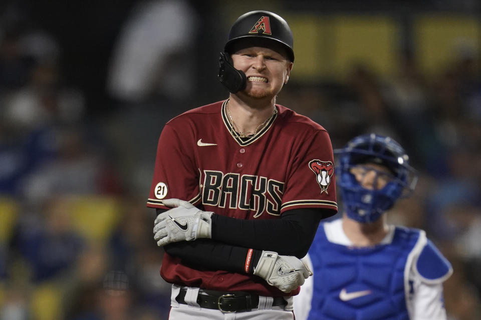 Arizona Diamondbacks' Pavin Smith reacts to being hit by a pitch from Los Angeles Dodgers relief pitcher Alex Vesia during the seventh inning of a baseball game Wednesday, Sept. 15, 2021, in Los Angeles. (AP Photo/Ashley Landis)