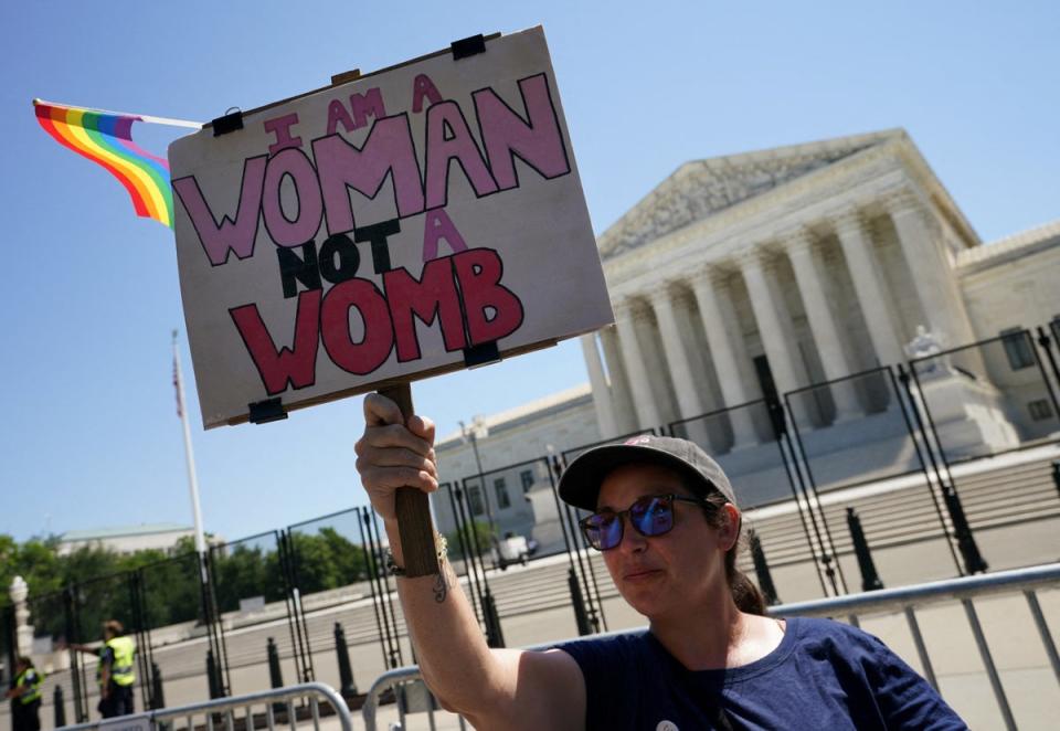 An abortion activist demonstrating outside the US Supreme Court (Reuters)