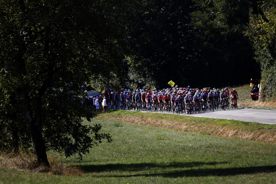 The pack rides during the stage 19 of the Tour de France cycling race over 166 kilometers (103 miles), with start in Bourg-en-Bresse and finish in Champagnole, Friday, Sept. 18, 2020. (AP Photo/Christophe Ena)