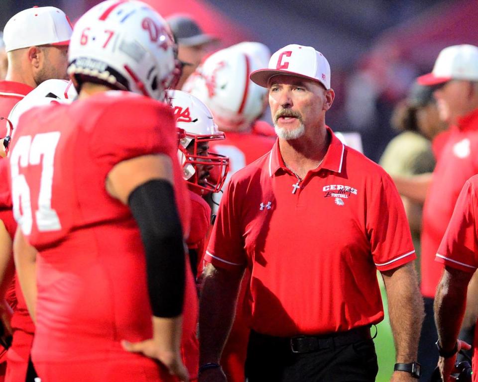 Ceres Head Coach Brett Johnson talks with his players during a game between Ceres and Beyer at Ceres High School in Ceres California on September 22, 2023.