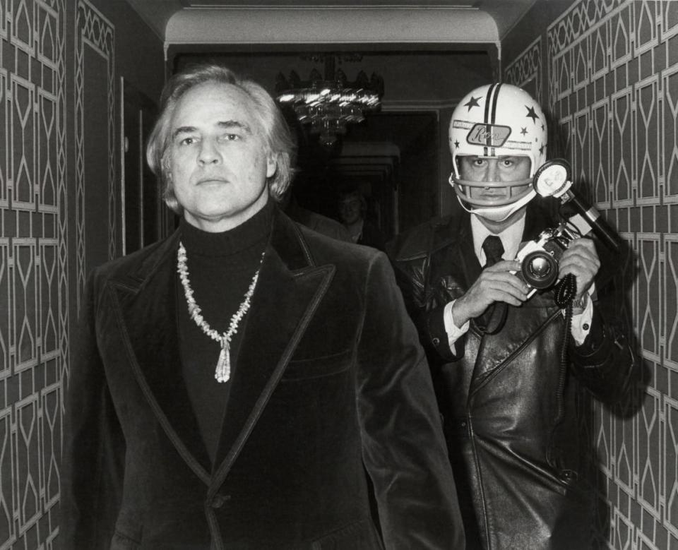 <div class="inline-image__caption"><p>(L to R) Marlon Brando and Ron Gallella on set for the documentary "Smash His Camera". Studio: Magnolia Pictures. Plot: A film centering on the life and work of Ron Galella that examines the nature and effect of paparazzi. </p></div> <div class="inline-image__credit">Entertainment Pictures / Alamy Stock Photo</div>