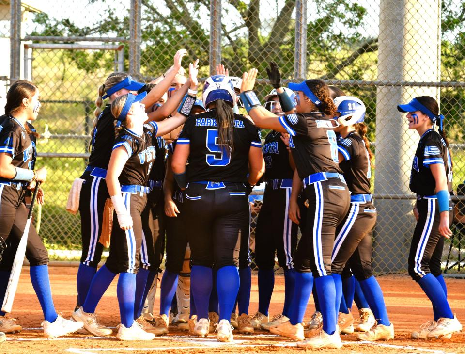 Park Vista's Nicole Mergen is celebrated by teammates as she crosses home plate following her first-inning home-run against Seminole Ridge on April 2, 2024.