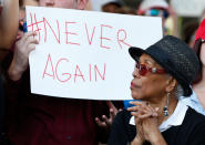 <p>Protesters hold signs at a rally for gun control at the Broward County Federal Courthouse in Fort Lauderdale, Fla., on Feb. 17, 2018. (Photo: Rhona Wise/AFP/Getty Images) </p>