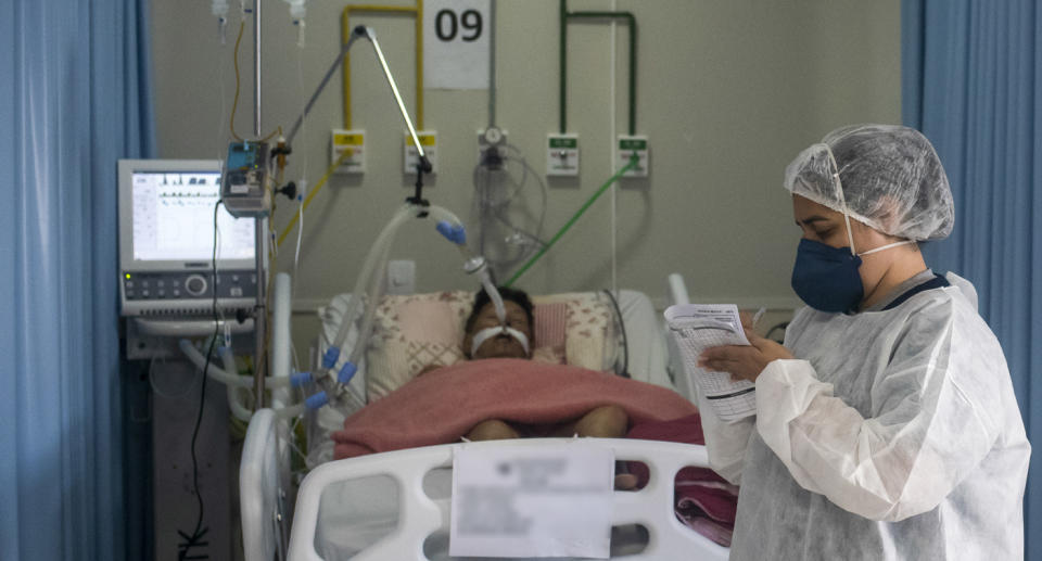 A patient fights for life in the Intensive Care Unit of the Municipal Hospital Sao Jose, in Duque de Caxias, Rio De Janeiro, on April 8. Source: Getty Images