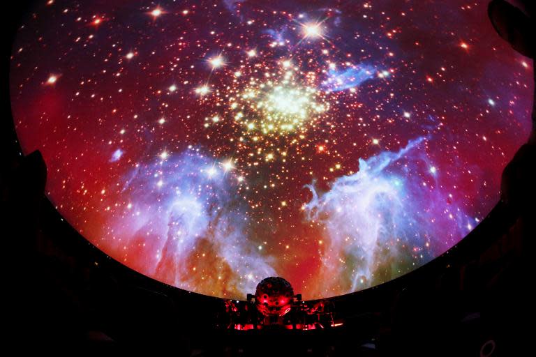 A projector screens a picture in the planetarium Hamburg, northern Germany, on August 26, 2013