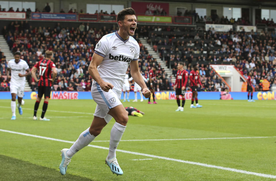 West Ham United's Aaron Cresswell celebrates scoring his side's second goal of the game against Bournemouth during their English Premier League soccer match at the Vitality Stadium in Bournemouth, England, Saturday, Sept. 28, 2019. (Mark Kerton/PA via AP)