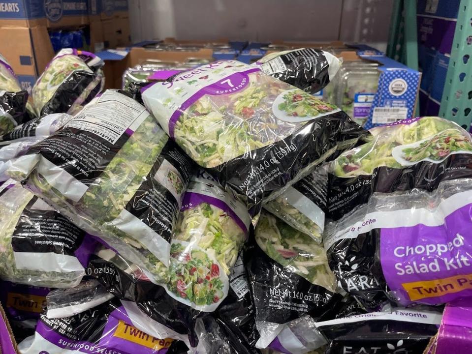 Bags of chopped kale salad in a box at Costco.