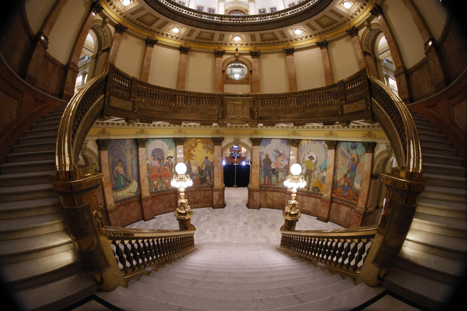 Empty stairs are shown in the rotunda of the State Capitol as the building remains closed to the public as part of the state's efforts to reduce the spread of the new coronavirus Monday, May 11, 2020, in Denver. State lawmakers announced that they plan to return to session in early June. (AP Photo/David Zalubowski)