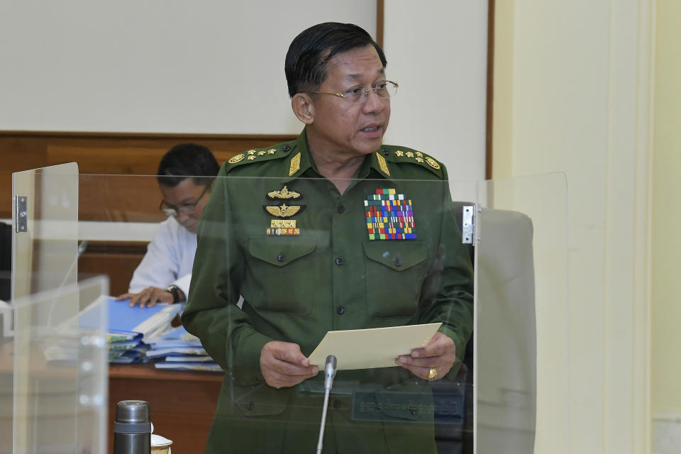 In this photo released from the The Military True News Information Team, Senior Gen. Min Aung Hlaing talks during the National Defense and Security Council meeting Tuesday, Jan. 31, 2023, in Naypyitaw, Myanmar. Myanmar’s military government announced Wednesday that is extending a state of emergency originally imposed when it seized power two years ago, a move that appears to set back its plans for an election that had been expected in August. (The Military True News Information Team via AP)