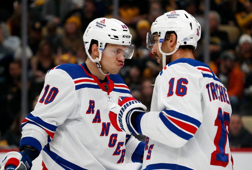 Nov 22, 2023; Pittsburgh, Pennsylvania, USA; New York Rangers left wing Artemi Panarin (10) and center Vincent Trocheck (16) talk before a face-off against the Pittsburgh Penguins during the second period at PPG Paints Arena.