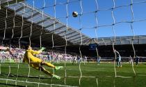 <p>Marko Arnautovic blazes a penalty over the bar for Stoke, who concede a second goal against Swansea just a minute later </p>