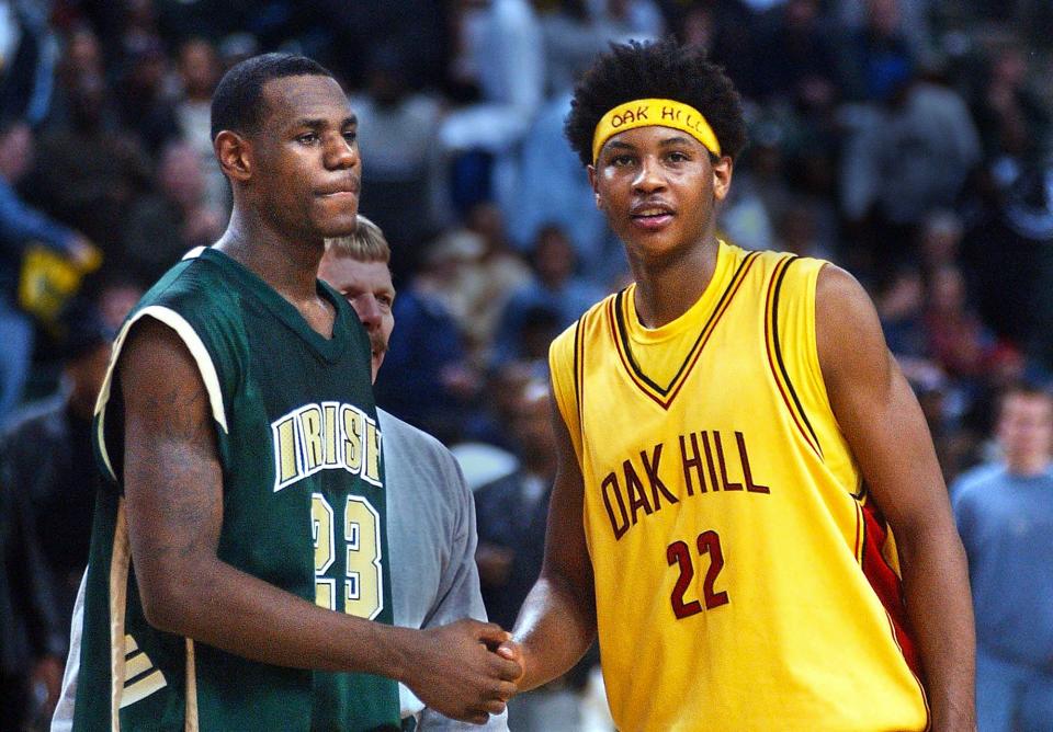 St. Vincent-St. Mary junior LeBron James and Oak Hill senior Carmelo Anthony meet at half court after the Irish's 72-66 loss. James had 36 points in the game in 2002.