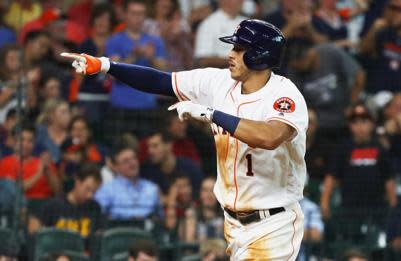 Carlos Correa celebrates a surprisingly historic home run. (AP)