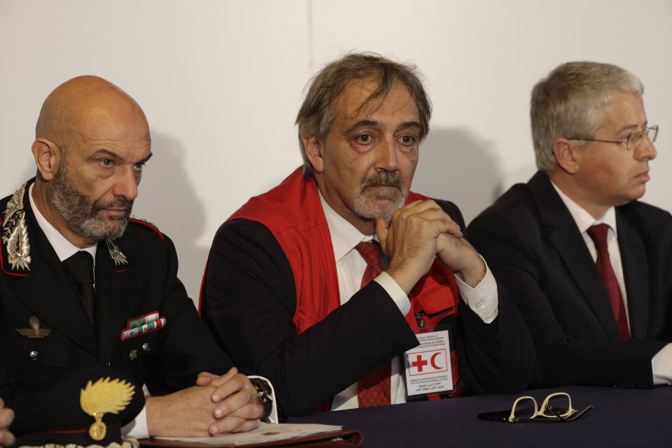 From left, Carabinieri Anti-terrorism Colonel Marco Rosi, IFRC President Francesco Rocca, and Albania's Interior Minister Sander Lleshaj, attend a press conference at Rome's Fiumicino airport Friday, Nov. 8, 2019. 11-year-old Alvin, an Albanian boy who was taken to Syria by his mother when she joined the Islamic State group has been freed from a crowded detention camp in northeastern Syria and returned home to Italy where his father lives. (AP Photo/Gregorio Borgia)