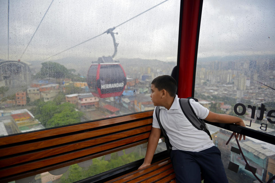 Venezuelan child Leobardo Medina, 8, goes to school in Caracas, on June 20, 2013. 