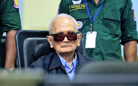 Former Khmer Rouge leader Nuon Chea sits in court at the ECCC in Phnom Penh - Credit: MARK PETERS/ AFP