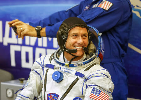 The International Space Station (ISS) crew member Shane Kimbrough of the U.S. smiles after donning a space suit at the Baikonur cosmodrome, Kazakhstan October 19, 2016. REUTERS/Shamil Zhumatov