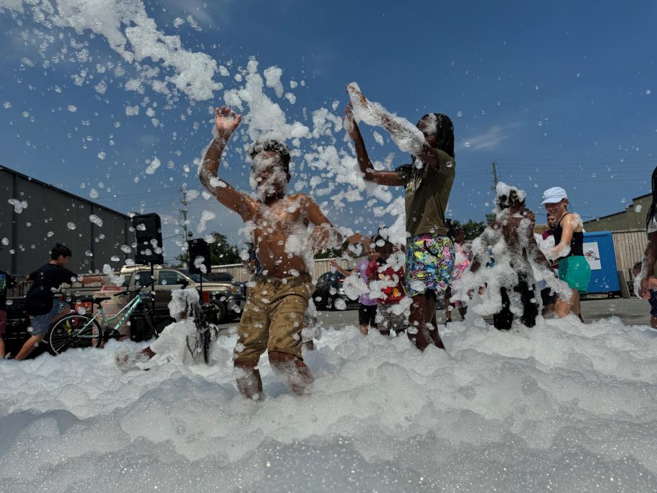 Children play at a foam party during the Fiesta Latina in Pensacola, Florida, in June 2024.