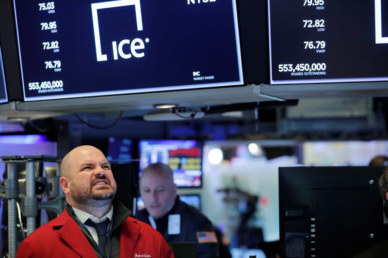 Traders work on the floor of the New York Stock Exchange shortly as coronavirus disease (COVID-19) cases in the city of New York rise