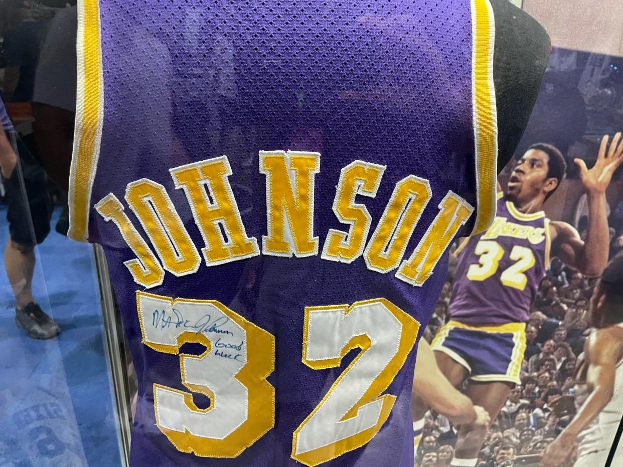 This 1980 Finals game-worn Magic Johnson jersey, displayed at The National, could fetch more than $600,000 at Heritage Auctions. (Eric Edholm/Yahoo Sports)