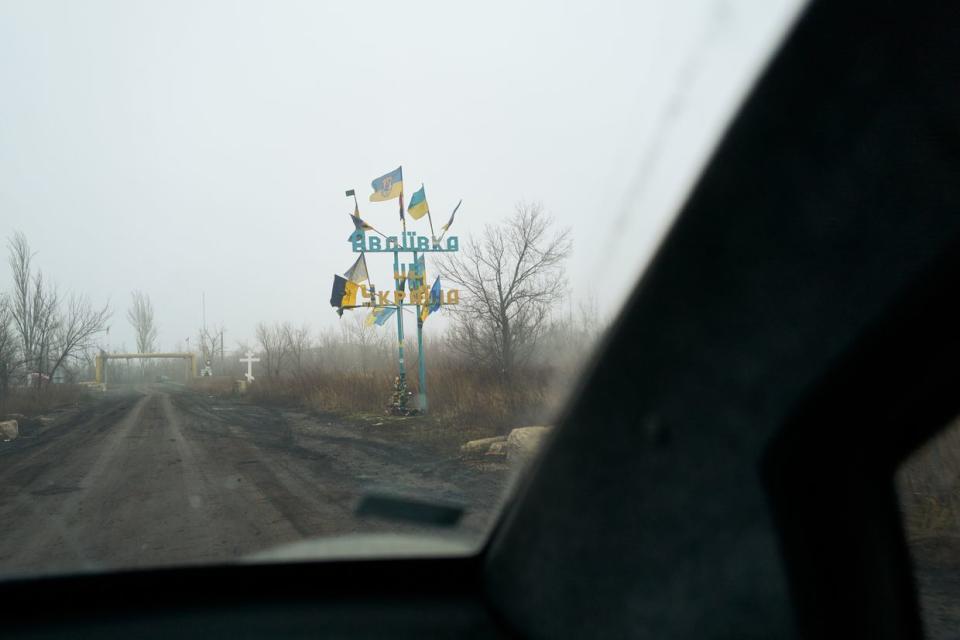 The sign marking the entrance of Avdiivka is seen amid artillery shelling on Dec. 31, 2023, in Avdiivka, Donetsk Oblast. (Pierre Crom/Getty Images)
